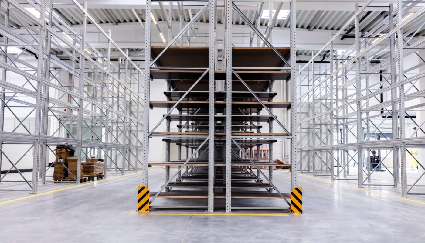 warehouse-industrial-hall-racking-storage-racks-2025-03-24-23-12-01-utc Industrial warehouse with heavy duty storage shelves and MDF shelving boards – ideal for warehouse fit-outs and wooden shelving NZ.